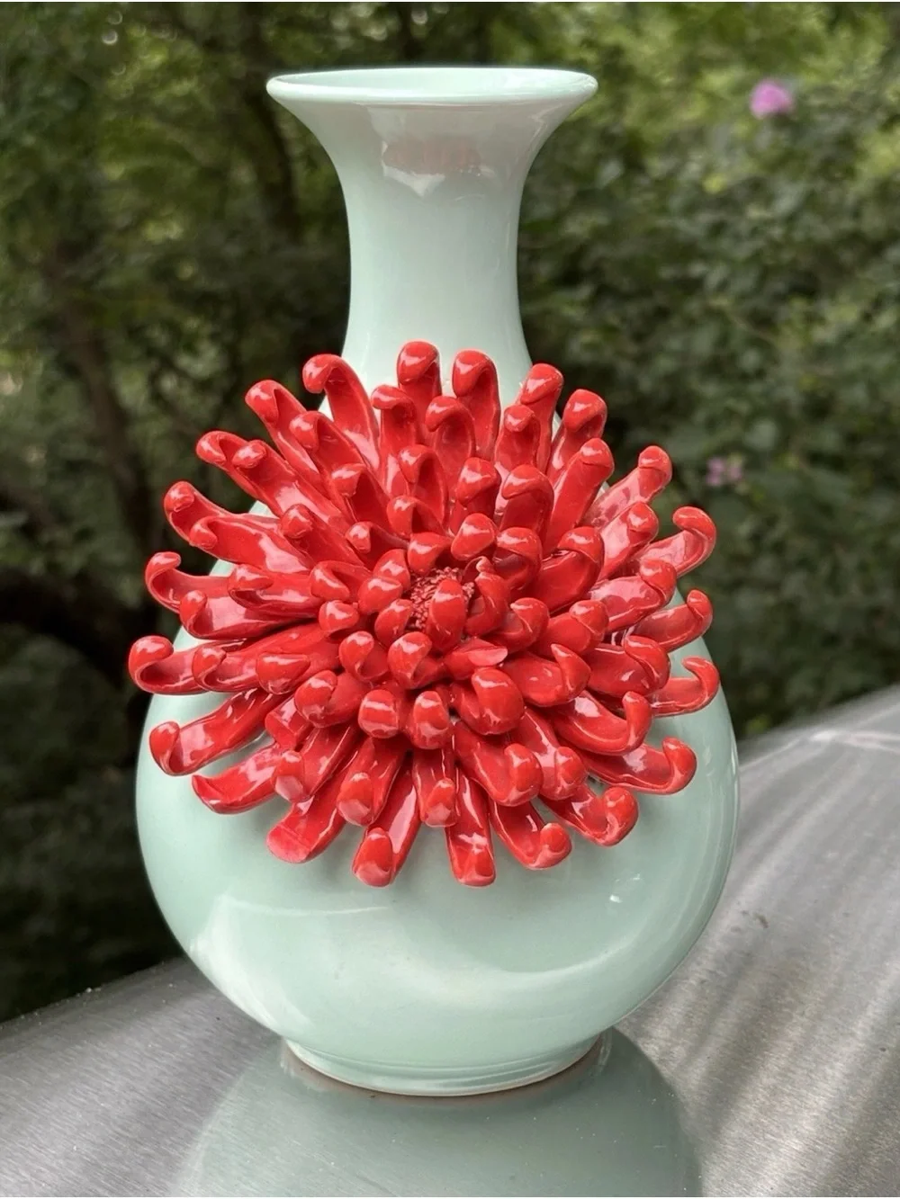 Anthropologie Ceramic Vase features a 3D red chrysanthemum bloom against a celad
